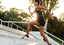 woman running up stairs outdoors