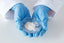hands with medical gloves holding aluminum chloride