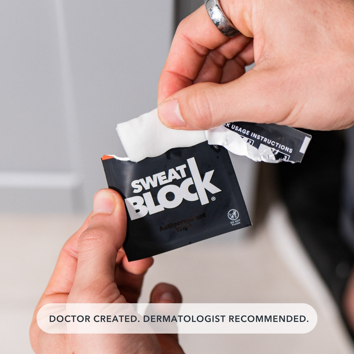 Man holding Doctor Created Antiperspirant Wipe for Excessive Sweating.
